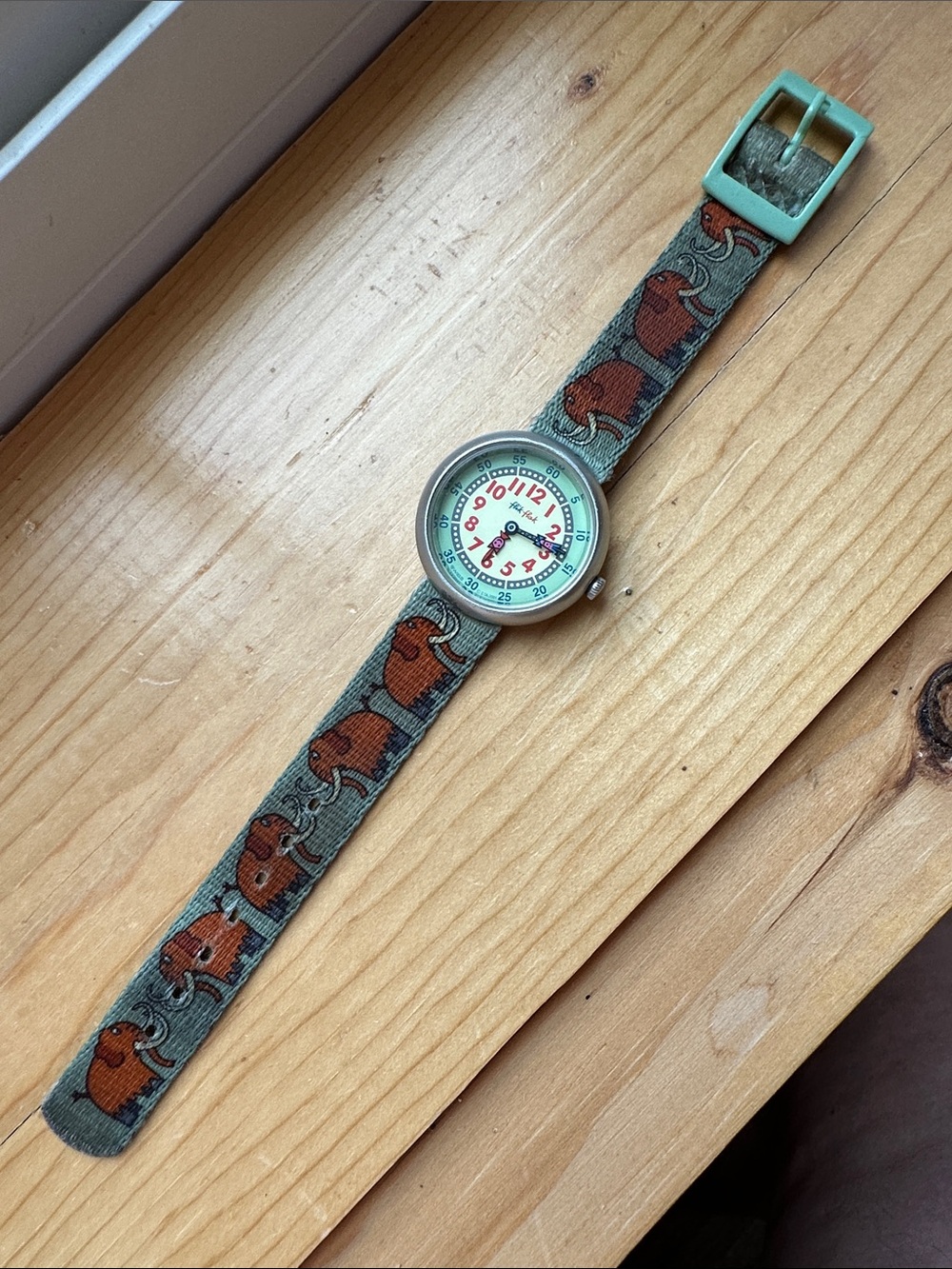 Swatch Kids Flik Flak Watch with Green Strap Brown Mammoth Pattern